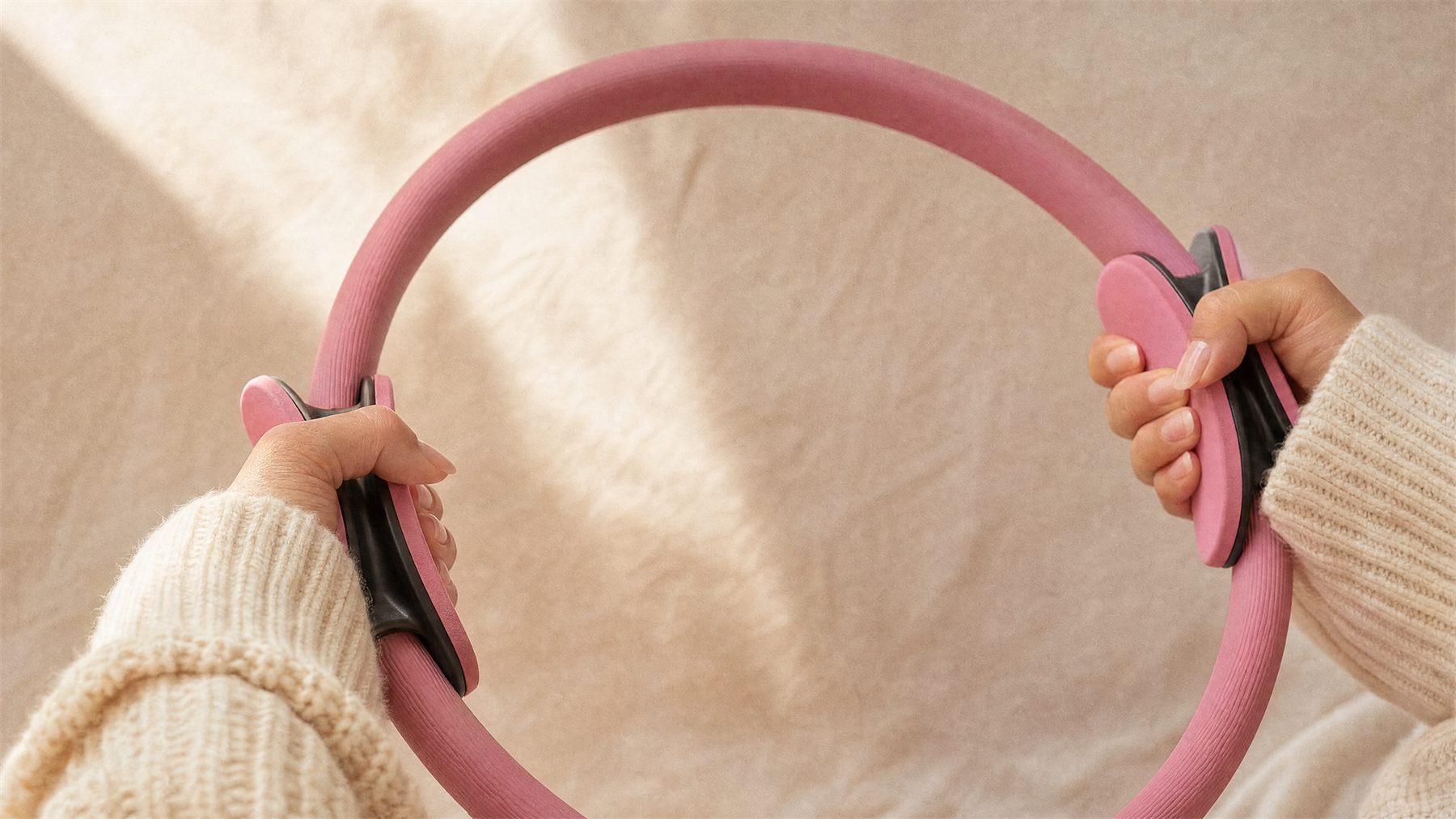Pilates ring grip handles — tactile detail